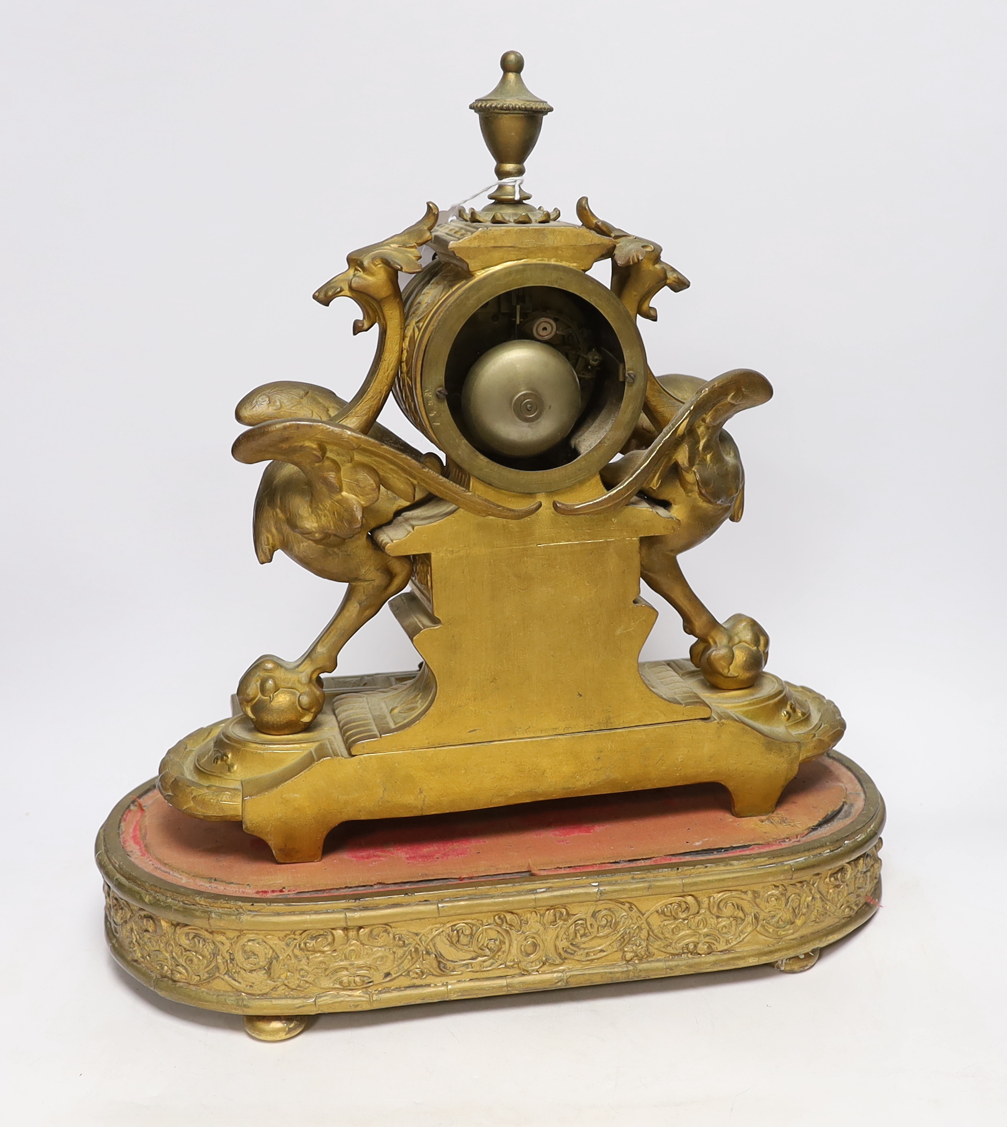 A Victorian gilt painted spelter mantel clock garniture, (dome missing) clock 43cm high